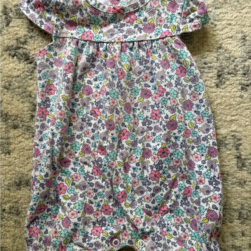 Simple Floral Baby Outfit with Pink and Blue Accents